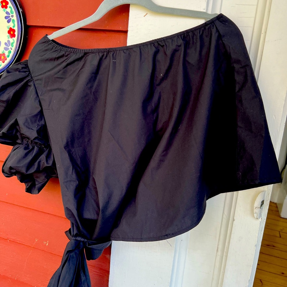 Black one arm/shoulder top with black tie. Never worn.